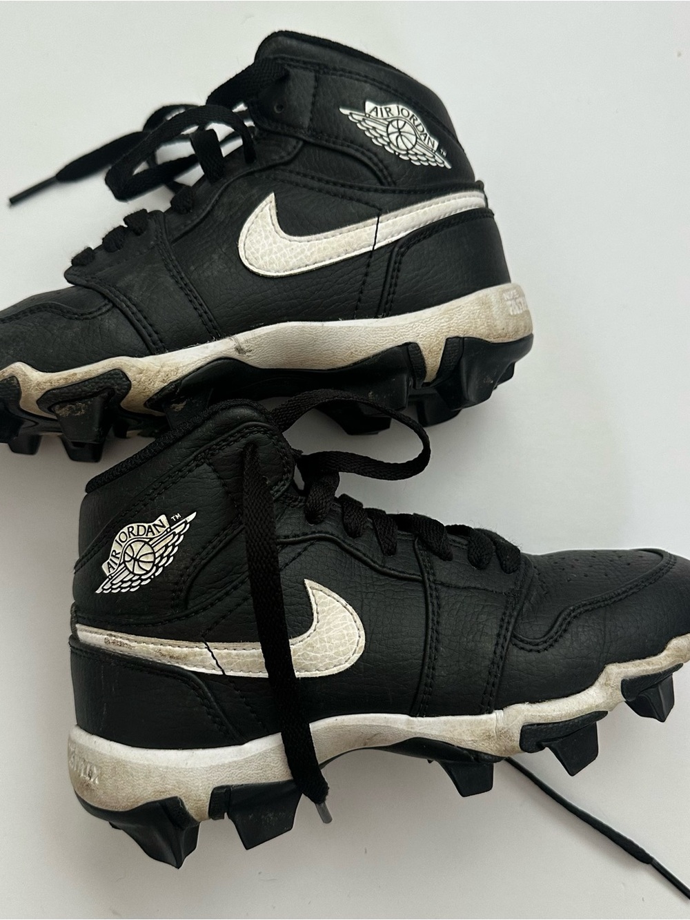 Jordan Kids Black and White Cleat Sneakers with Iconic Swoosh